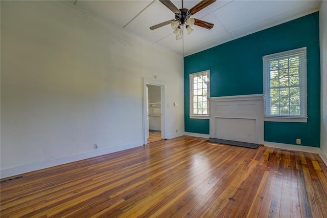 empty room featuring wood-type flooring and ceiling fan