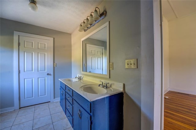 bathroom featuring vanity and hardwood / wood-style flooring