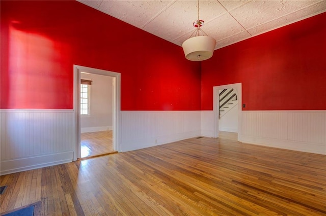 unfurnished room featuring hardwood / wood-style floors