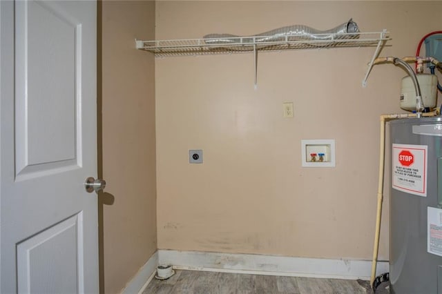 laundry room featuring hookup for a washing machine, water heater, light wood-type flooring, and electric dryer hookup