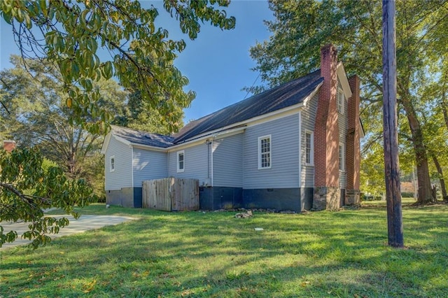 view of home's exterior featuring a yard