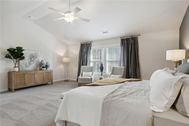 bedroom featuring a ceiling fan, visible vents, light colored carpet, baseboards, and lofted ceiling