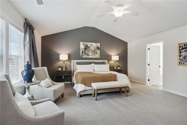 bedroom featuring ceiling fan, visible vents, vaulted ceiling, baseboards, and carpet flooring