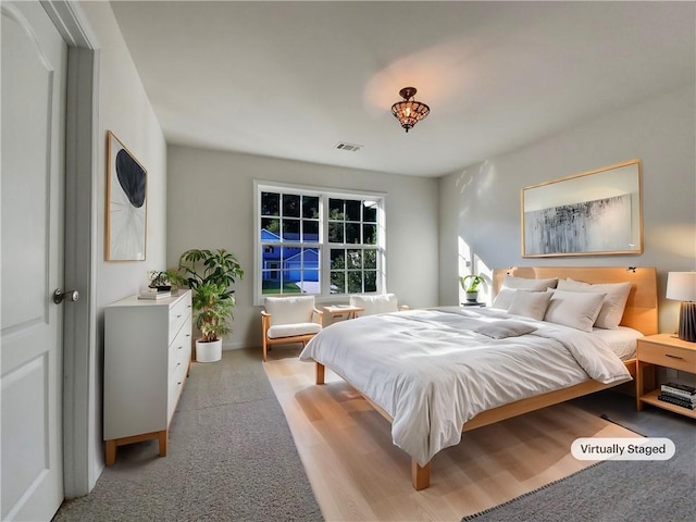 bedroom featuring light wood-type flooring