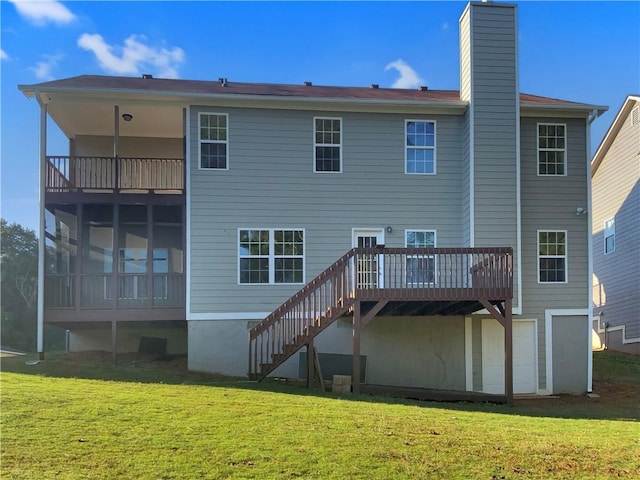 rear view of house featuring a yard