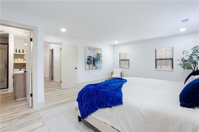 bedroom with recessed lighting, wood finished floors, visible vents, and baseboards