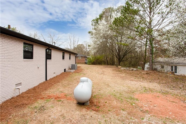 view of yard featuring central AC