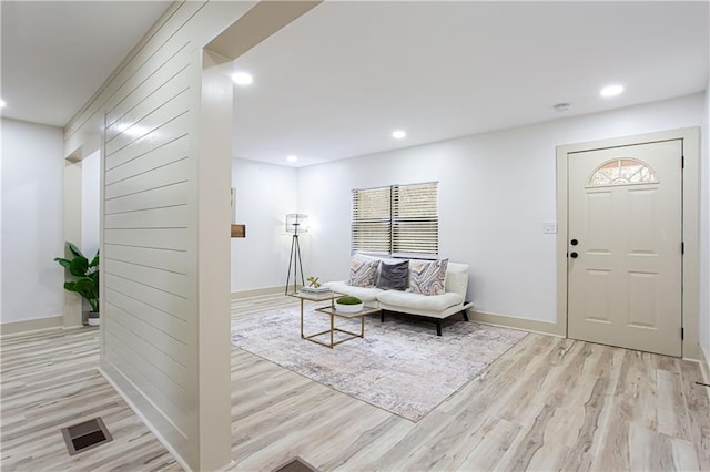 entryway featuring recessed lighting, visible vents, baseboards, and wood finished floors