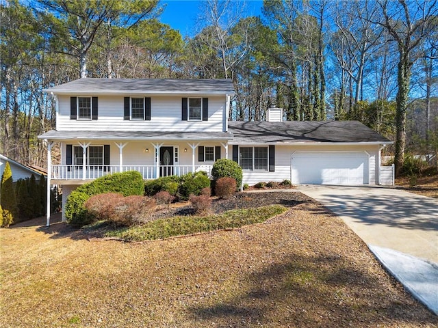 view of front of home with a garage and a porch