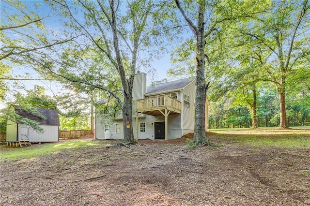 733 Wesley Chapel Rd, Villa Rica, GA 30180 - back of property with a storage shed, a chimney, and a deck