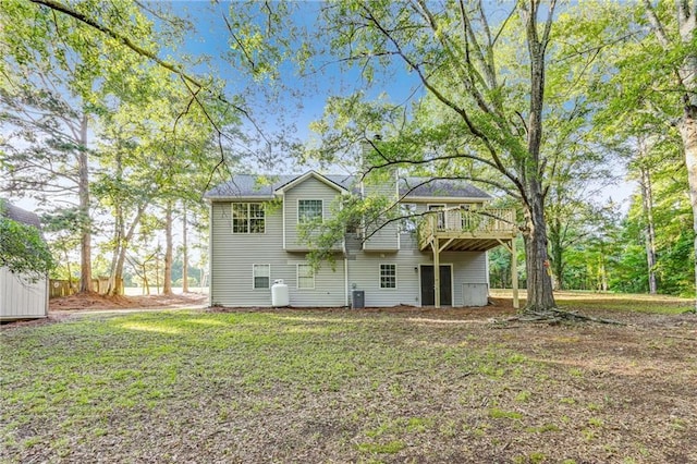 733 Wesley Chapel Rd, Villa Rica, GA 30180 - back of house featuring a lawn and a wooden deck