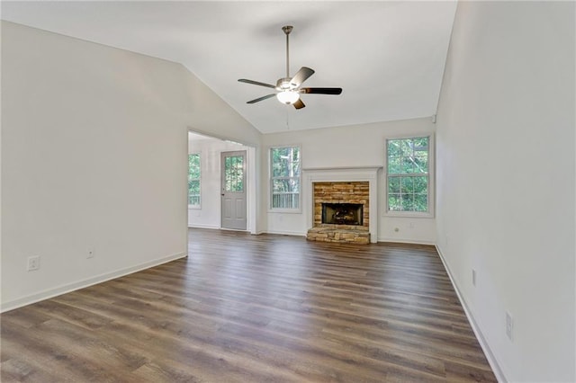 733 Wesley Chapel Rd, Villa Rica, GA 30180 - unfurnished living room featuring ceiling fan, dark wood finished floors, a stone fireplace, and high vaulted ceiling