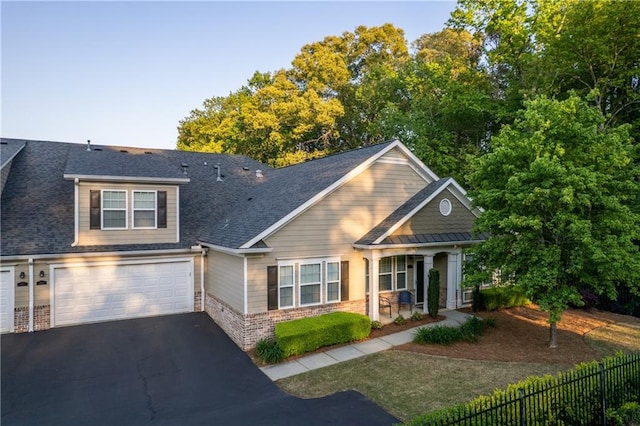 2623 Grapevine Cir Unit 602, Cumming, GA 30041 - craftsman inspired home featuring fence, brick siding, a garage, aphalt driveway, and a porch