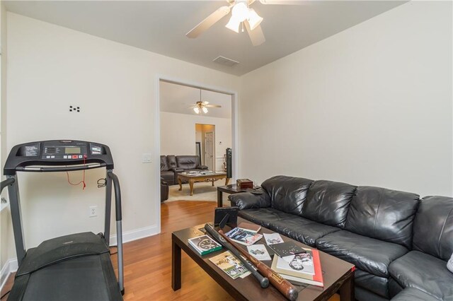 2623 Grapevine Cir Unit 602, Cumming, GA 30041 - living room with baseboards, a ceiling fan, wood finished floors, and visible vents