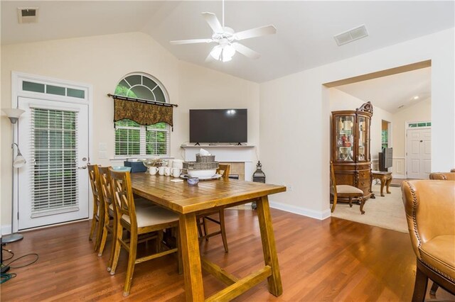 2623 Grapevine Cir Unit 602, Cumming, GA 30041 - dining room featuring visible vents, ceiling fan, wood finished floors, and vaulted ceiling