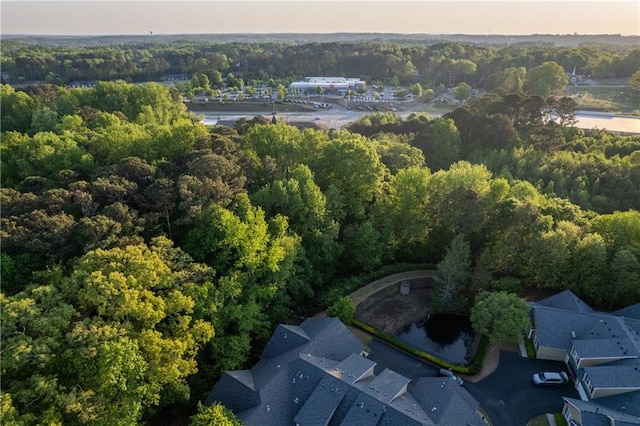 2623 Grapevine Cir Unit 602, Cumming, GA 30041 - aerial view at dusk featuring a wooded view