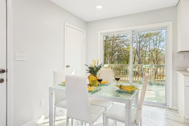 8298 Holly Dr, Jonesboro, GA 30238 - dining room featuring baseboards and recessed lighting