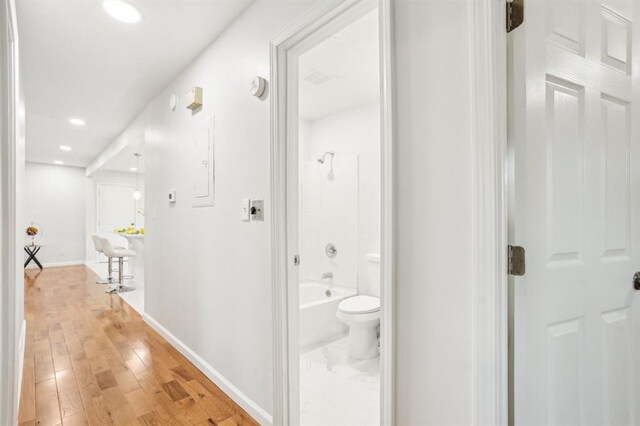 8298 Holly Dr, Jonesboro, GA 30238 - corridor with recessed lighting, light wood-type flooring, and baseboards