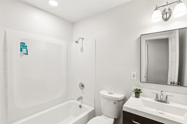8298 Holly Dr, Jonesboro, GA 30238 - bathroom featuring vanity, bathtub / shower combination, and toilet
