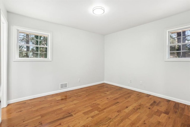 8298 Holly Dr, Jonesboro, GA 30238 - spare room with visible vents, baseboards, and light wood-style floors