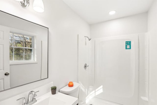 8298 Holly Dr, Jonesboro, GA 30238 - bathroom with a shower, vanity, and toilet