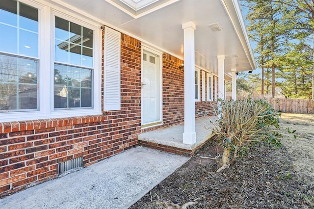 8298 Holly Dr, Jonesboro, GA 30238 - entrance to property with brick siding, fence, and covered porch