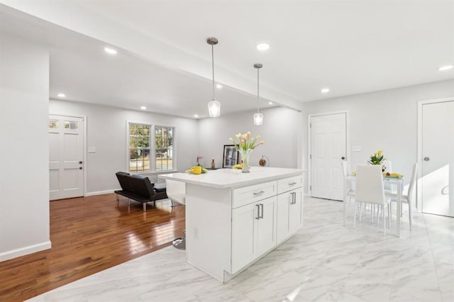 8298 Holly Dr, Jonesboro, GA 30238 - kitchen with baseboards, recessed lighting, white cabinetry, light countertops, and hanging light fixtures
