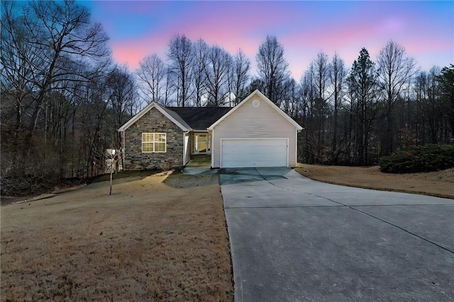 ranch-style house featuring a garage