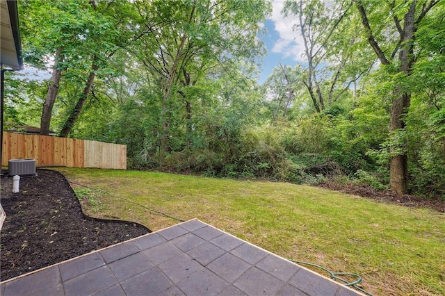 view of yard with a patio area and central AC unit