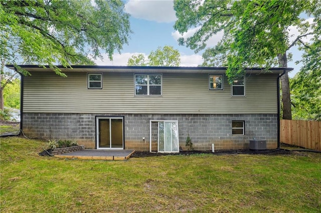 rear view of house with central AC unit and a patio