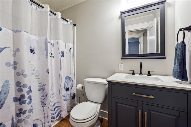 full bathroom with vanity, wood finished floors, toilet, crown molding, and a shower with shower curtain