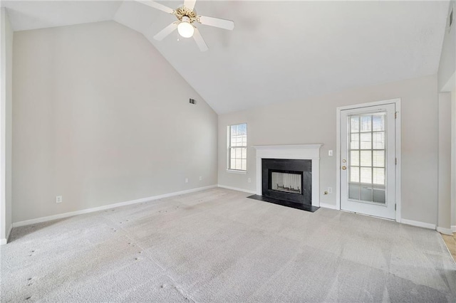 unfurnished living room featuring a fireplace with flush hearth, high vaulted ceiling, carpet floors, and baseboards