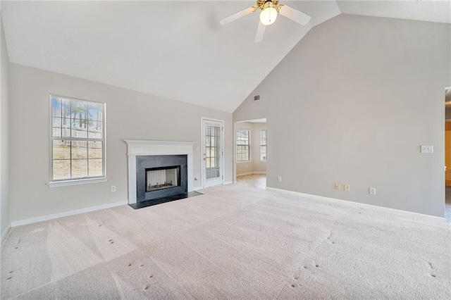 unfurnished living room featuring carpet, a fireplace, visible vents, and baseboards