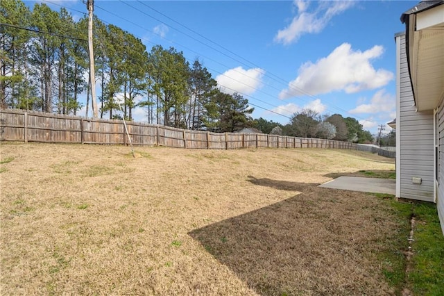 view of yard with a fenced backyard and a patio