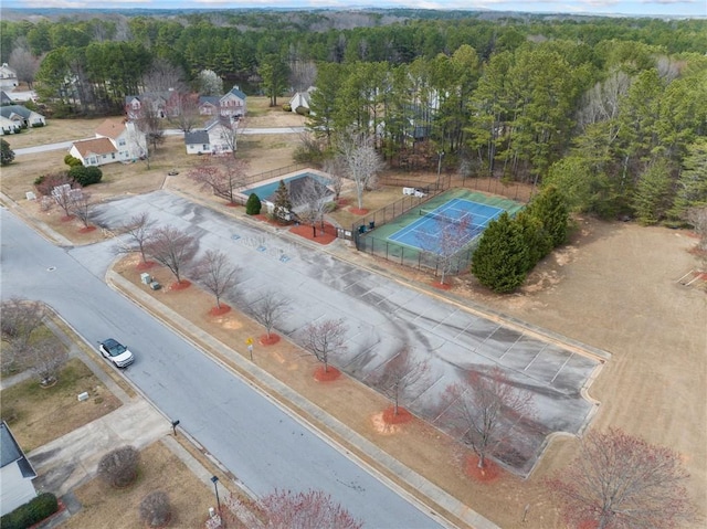 birds eye view of property with a wooded view