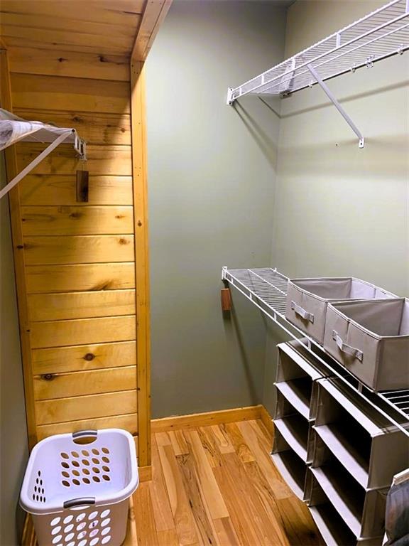 spacious closet featuring light wood-type flooring