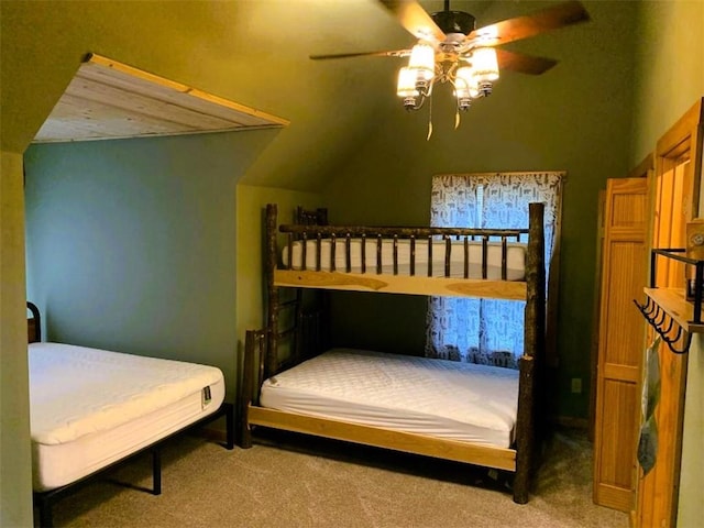 carpeted bedroom with lofted ceiling and ceiling fan