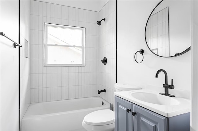 bathroom with toilet, washtub / shower combination, and vanity