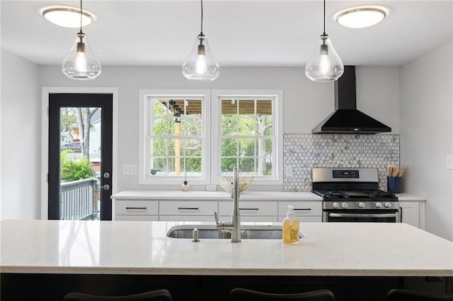 1251 Pierce Ave, Smyrna, GA 30080 - kitchen with wall chimney range hood, stainless steel gas range oven, healthy amount of natural light, and white cabinets