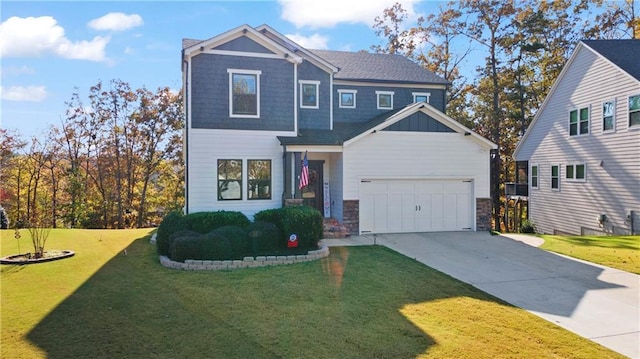 view of front of house with a front yard and a garage