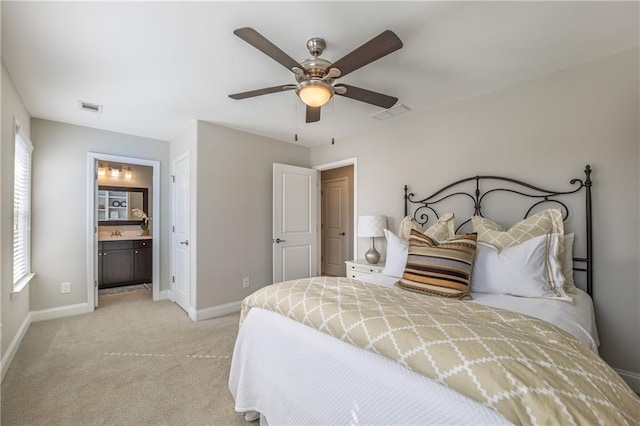 bedroom featuring visible vents, baseboards, crown molding, a raised ceiling, and light colored carpet