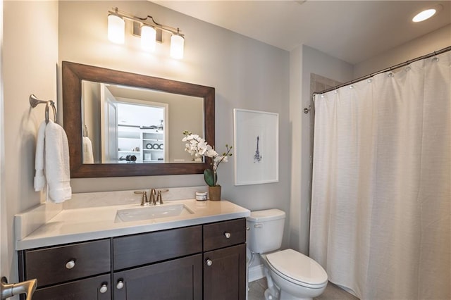 bedroom featuring light carpet, visible vents, baseboards, and a tray ceiling