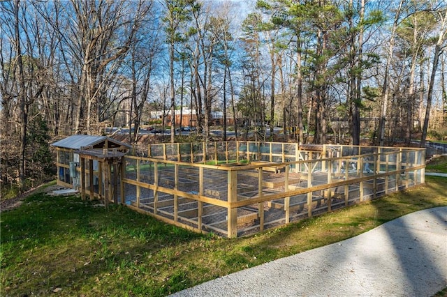 back of house featuring a wooden deck, stairs, and fence