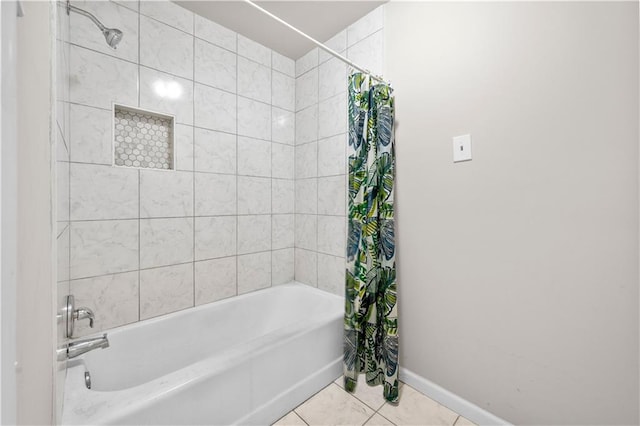 bathroom featuring shower / bathtub combination with curtain, baseboards, and tile patterned floors