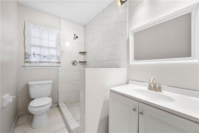 full bathroom with toilet, a walk in shower, and vanity