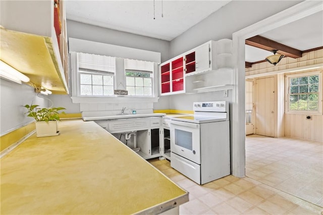5128 Lavista Rd, Tucker, GA 30084 - kitchen with electric stove, light flooring, light countertops, and open shelves
