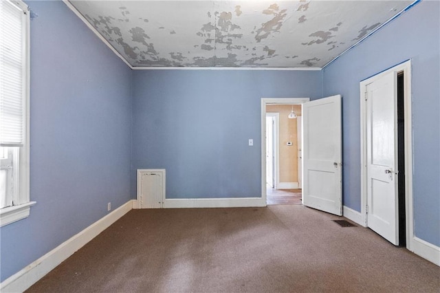 5128 Lavista Rd, Tucker, GA 30084 - unfurnished bedroom with carpet, multiple windows, crown molding, and baseboards