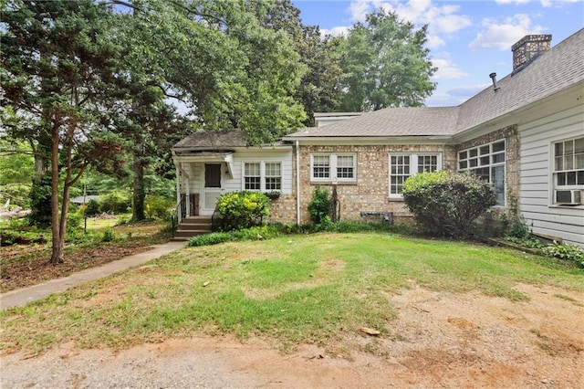 5128 Lavista Rd, Tucker, GA 30084 - view of front of home with a front lawn and cooling unit
