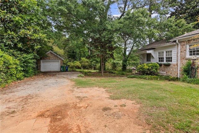 5128 Lavista Rd, Tucker, GA 30084 - view of yard with dirt driveway, an outdoor structure, and a garage