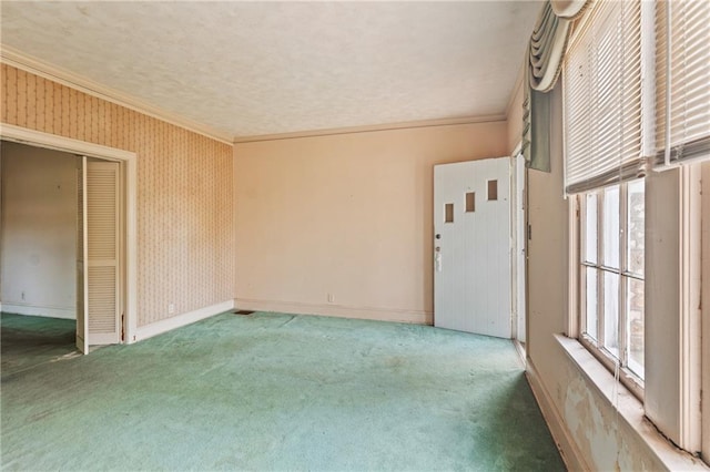5128 Lavista Rd, Tucker, GA 30084 - carpeted empty room featuring ornamental molding, baseboards, and wallpapered walls